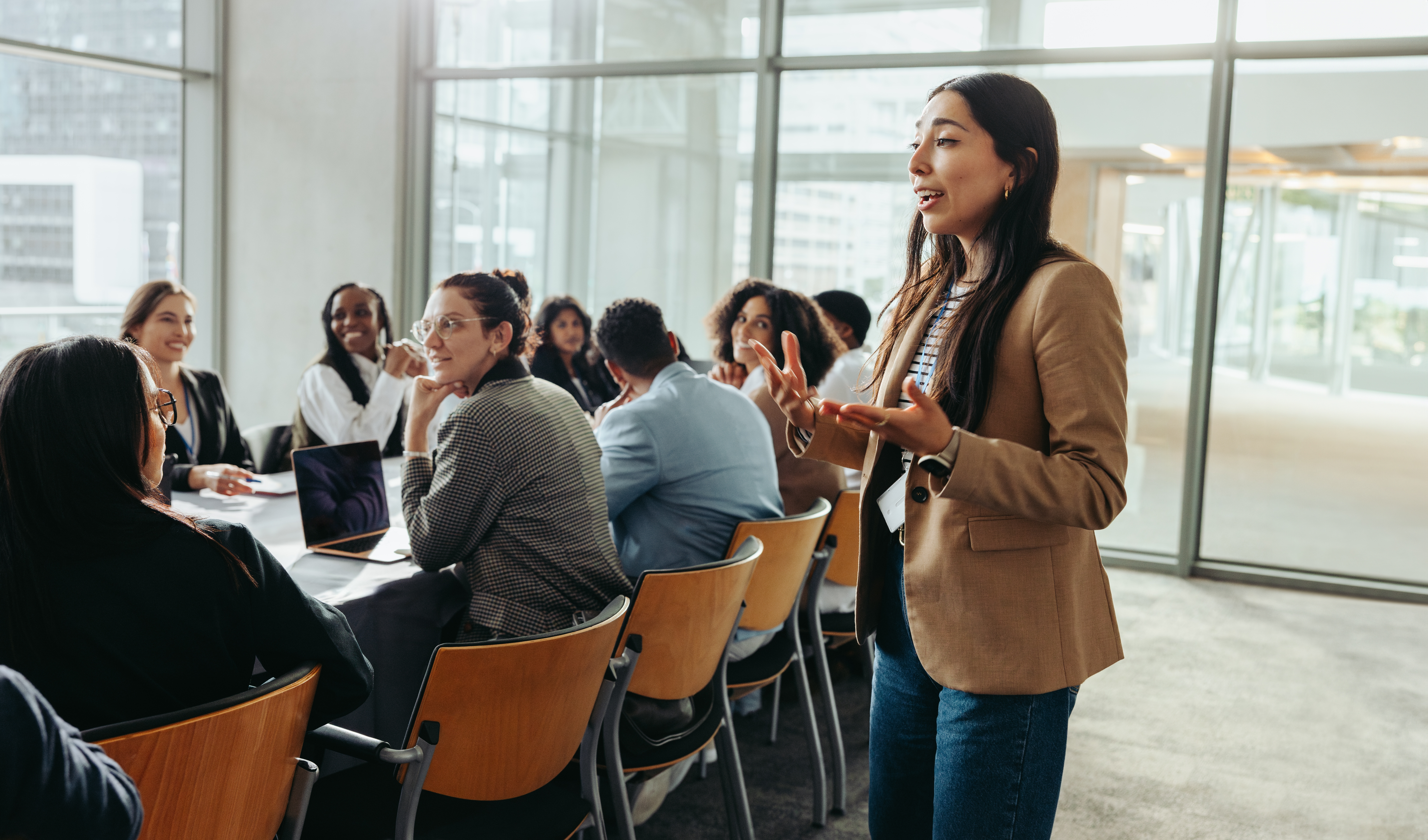 A female employee sharing her leadership lessons to her team.