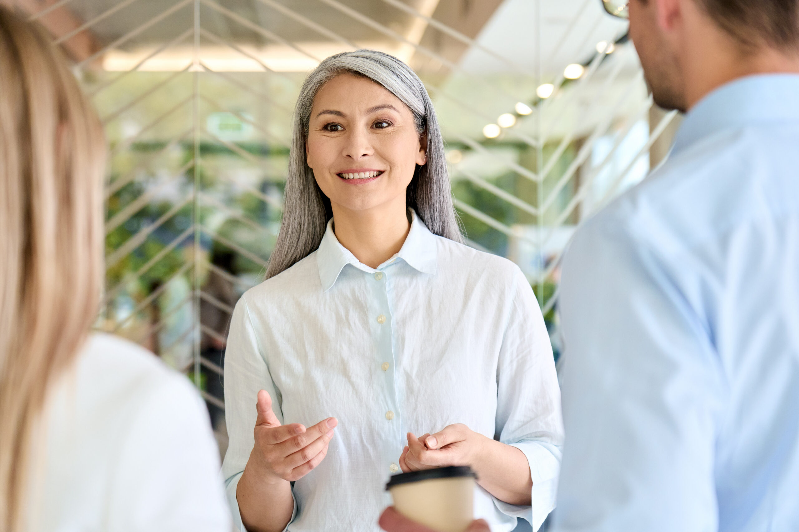 A sales rep with good brand representation, talking to customers.